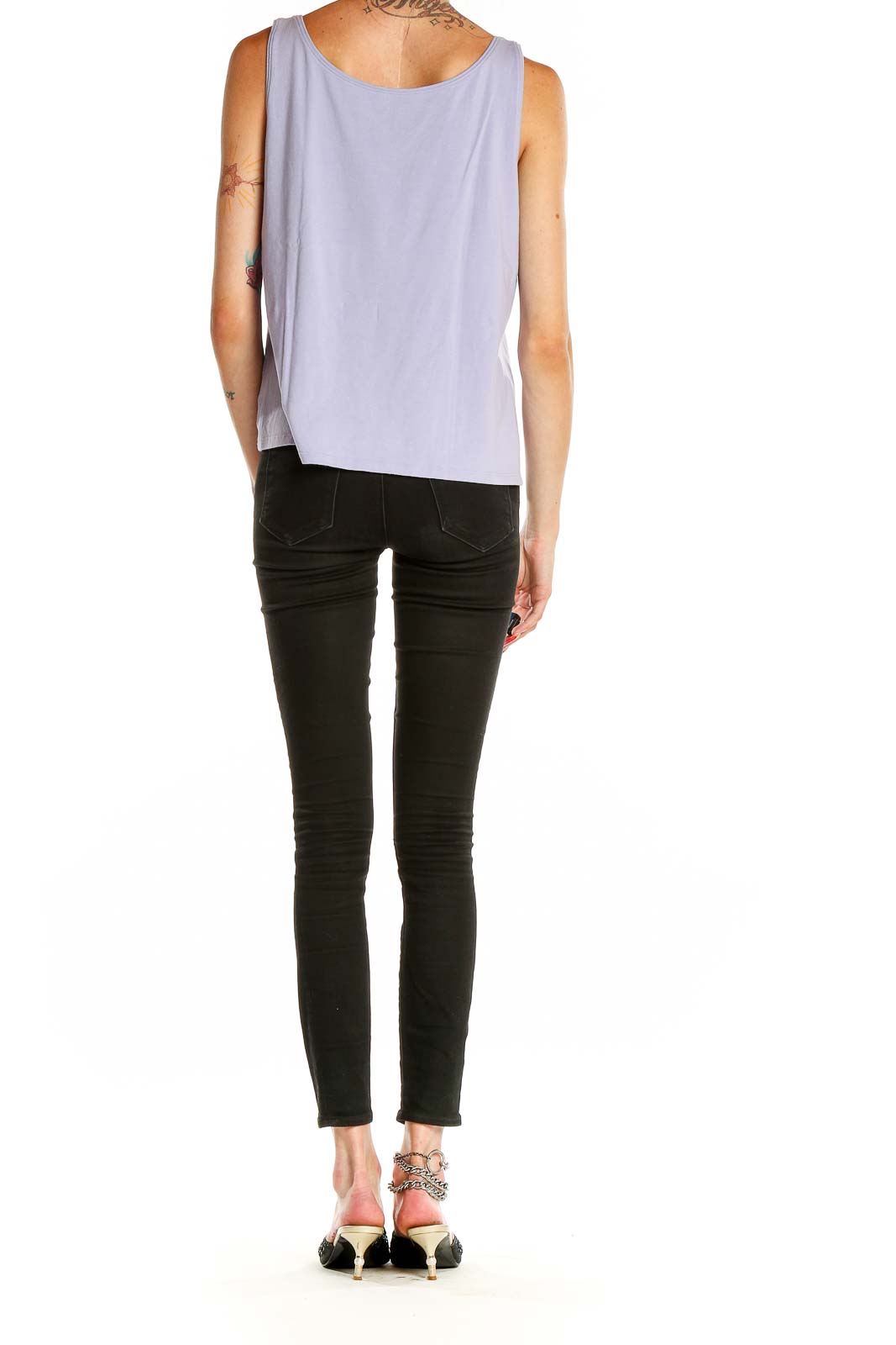 Back view of lavender Eileen Fisher sleeveless tank top on model with black pants