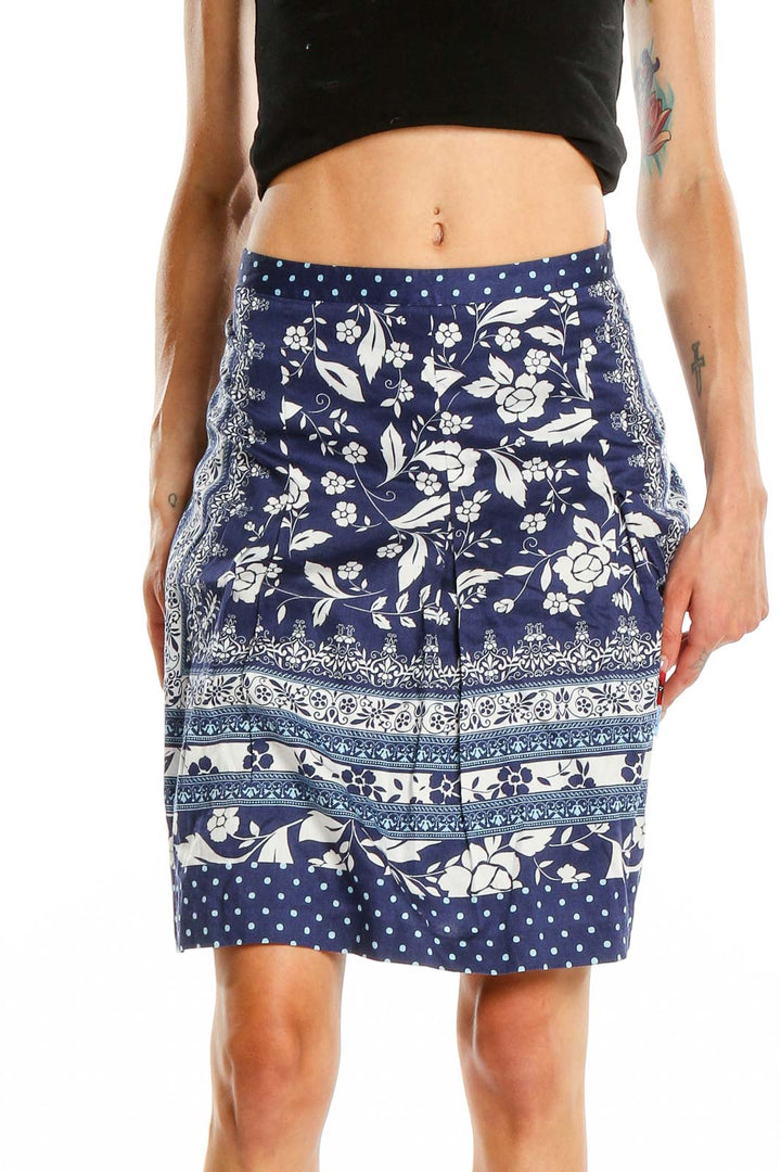 Front view of Ann Taylor LOFT navy floral print A-line skirt with polka dot hem