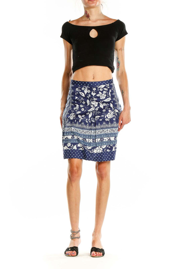 Front view of Ann Taylor LOFT navy floral print A-line skirt with polka dot hem