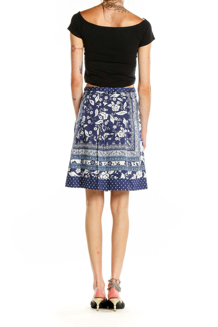 Back view of Ann Taylor LOFT navy floral print A-line skirt showing full pattern