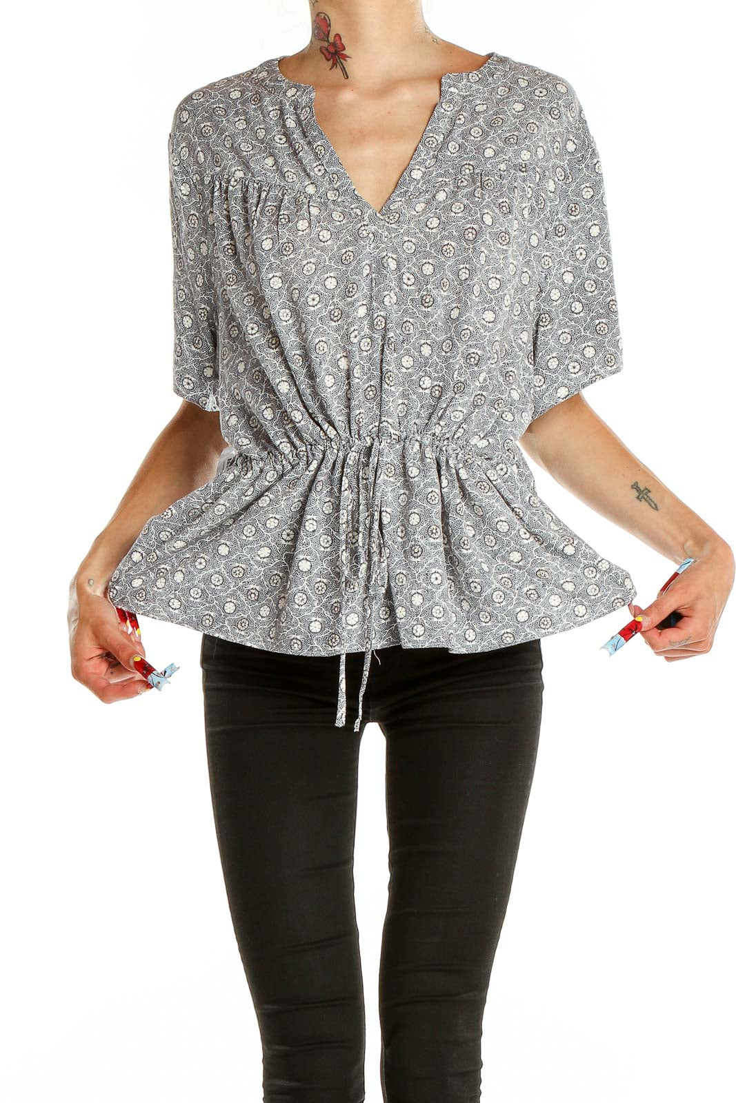 Front view of Treasure & Bond gray floral print peplum top with V-neck and short sleeves