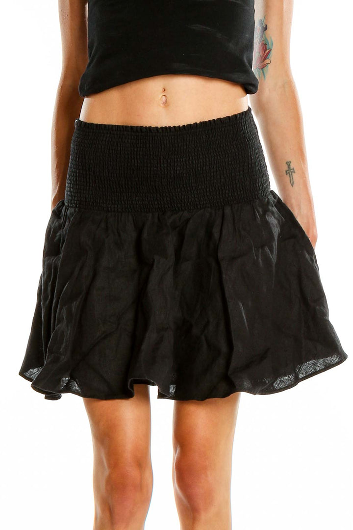 Front view of J.Crew black mini skirt with smocked waistband