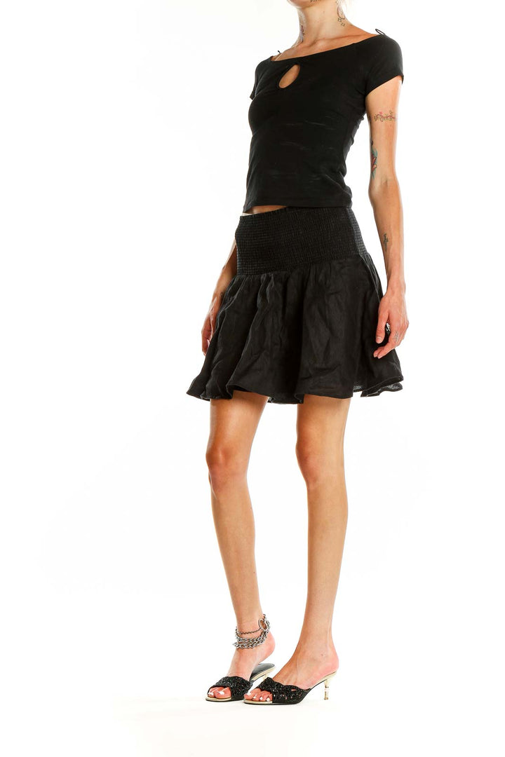 Front view of J.Crew black mini skirt with smocked waistband