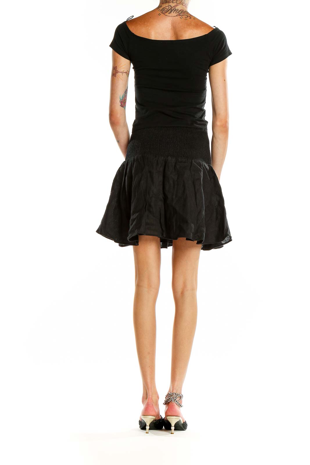 Back view of J.Crew black mini skirt showing flowy silhouette