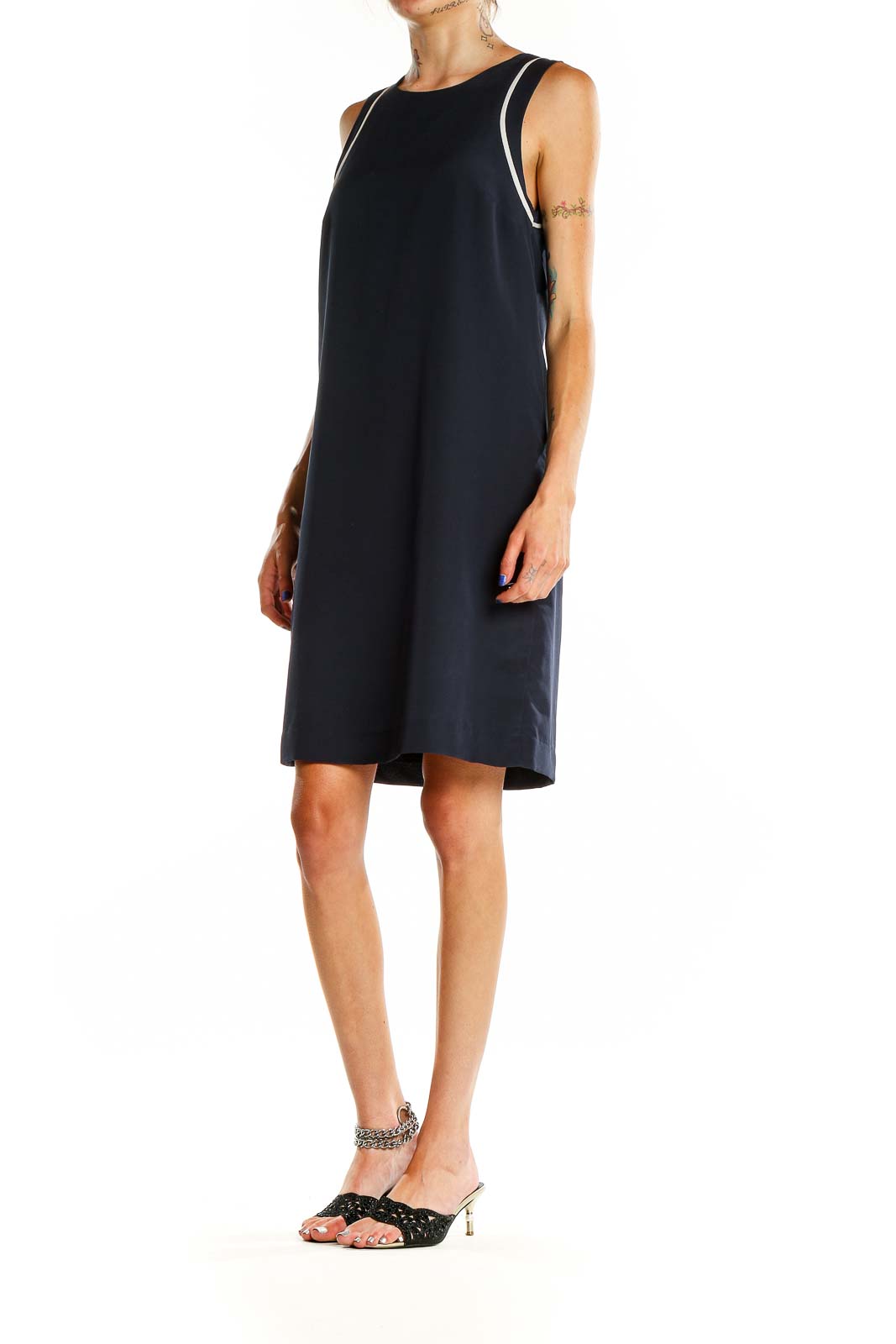 Front view of Banana Republic navy sleeveless shift dress with white piping