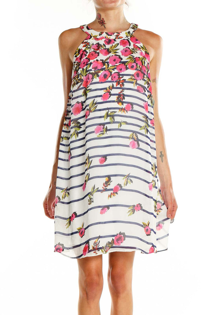 Front view of Betsy Johnson white halter dress with pink floral print and navy stripes