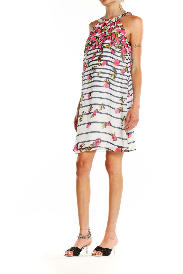 Front view of Betsy Johnson white halter dress with pink floral print and navy stripes