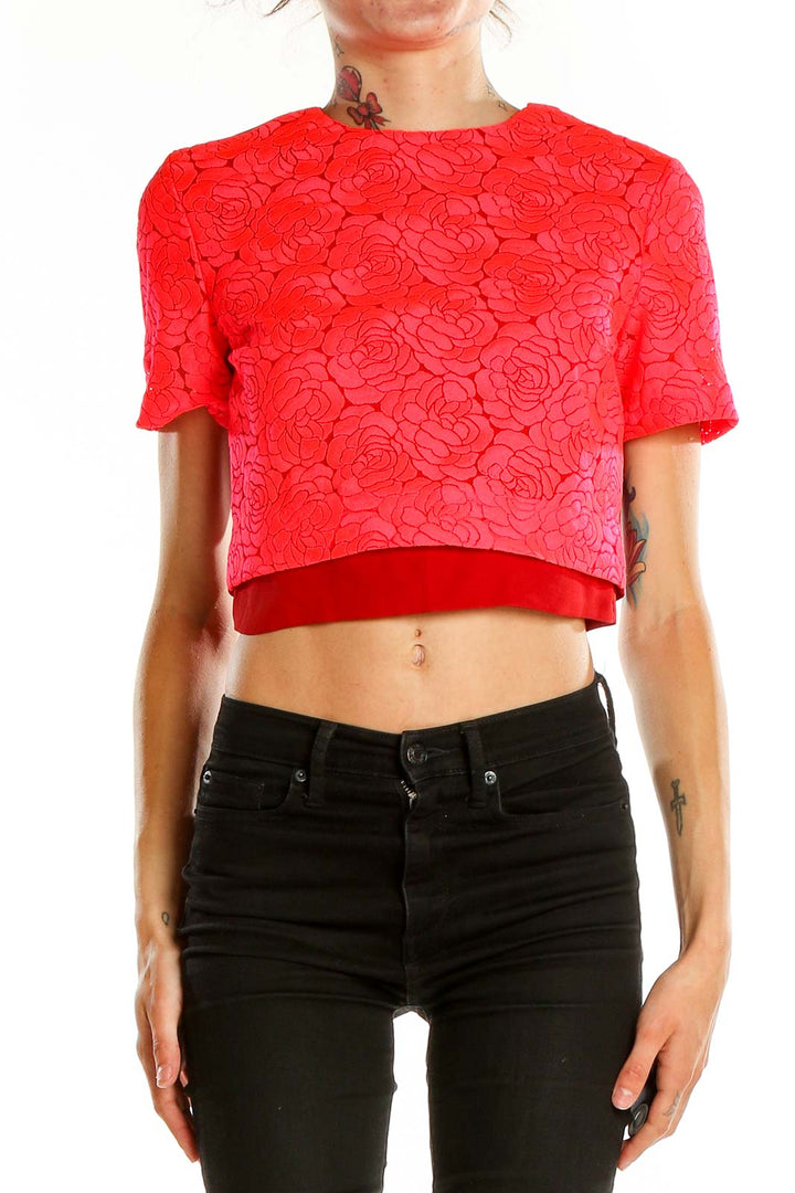 Front view of A.L.C. red floral lace crop top with rose pattern