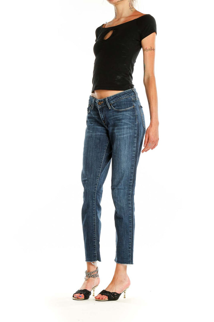 Front view of Levi's blue cropped straight-leg jeans on model