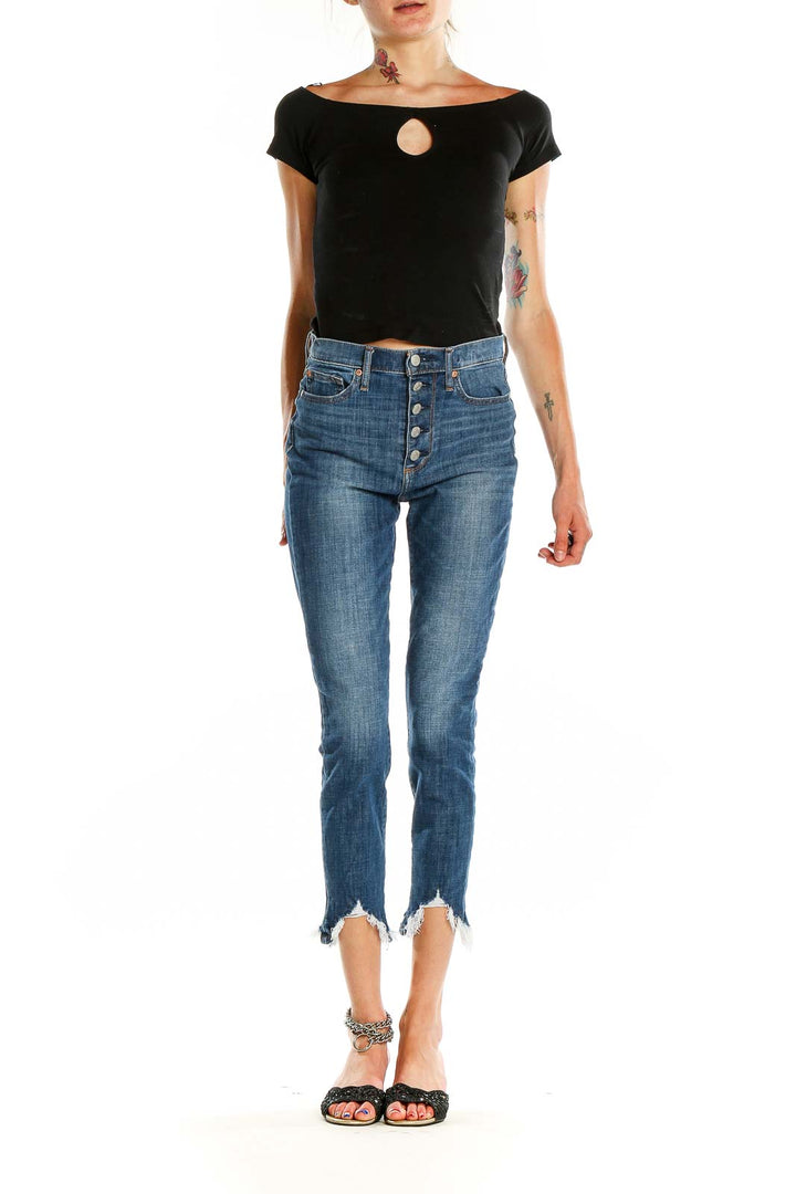 Front view of Gap blue cropped jeans with button-fly closure and raw hem