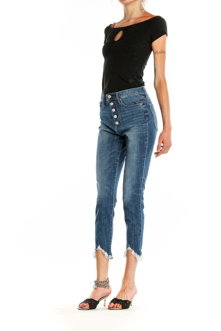 Front view of Gap blue cropped jeans with button-fly closure and raw hem