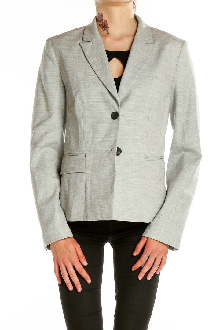 Front view of light gray Banana Republic blazer with two-button closure