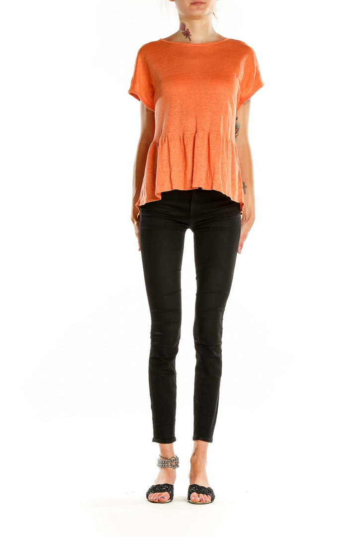 Front view of orange linen peplum top by Cynthia Rowley