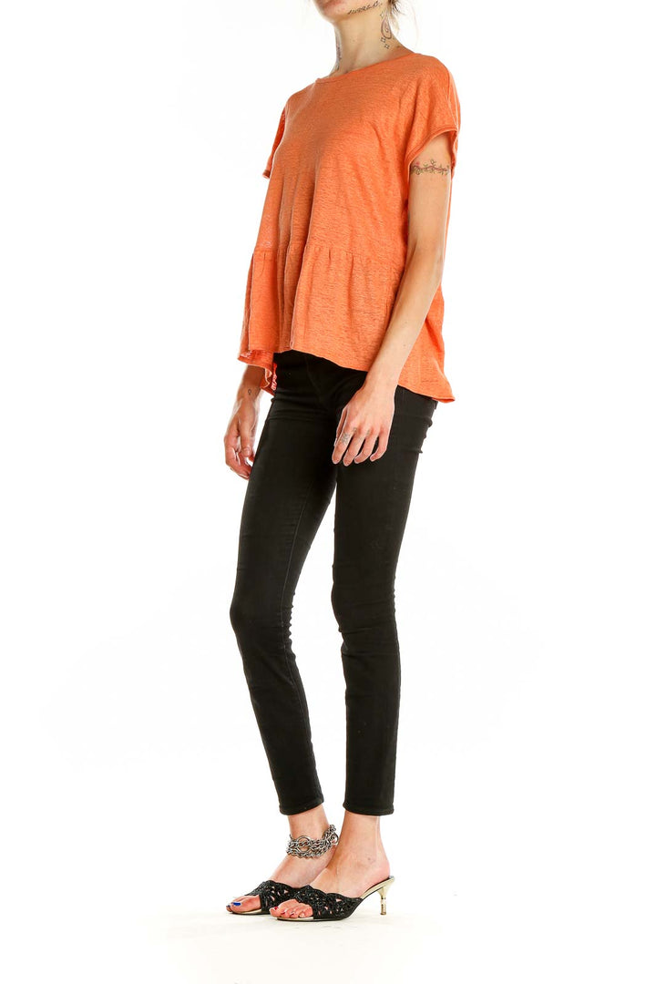 Front view of orange linen peplum top by Cynthia Rowley