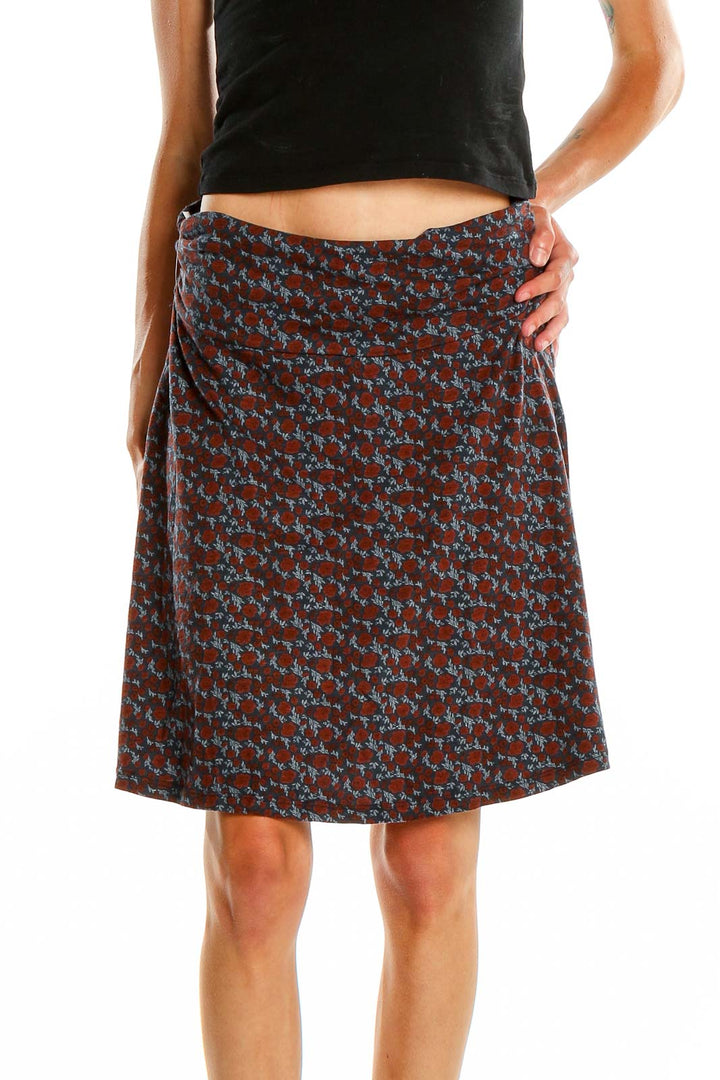 Front view of Toad&Co brown floral print A-line skirt with blue flowers