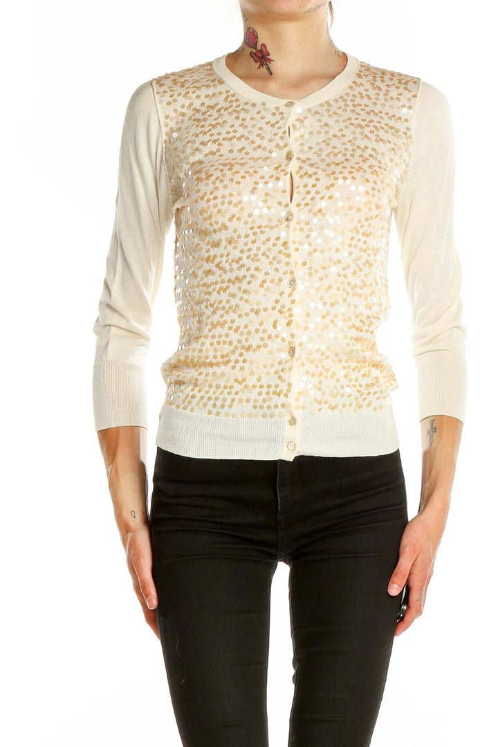 Front view of J.Crew cream cardigan with golden floral embellishments