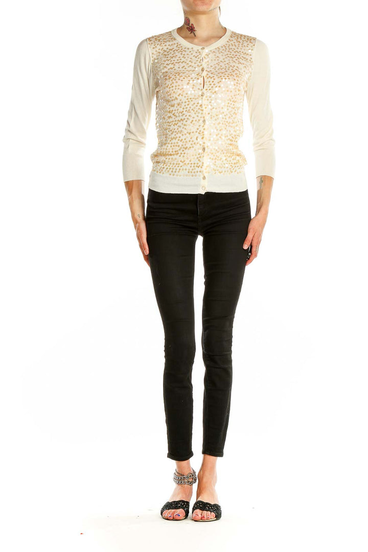 Front view of J.Crew cream cardigan with golden floral embellishments