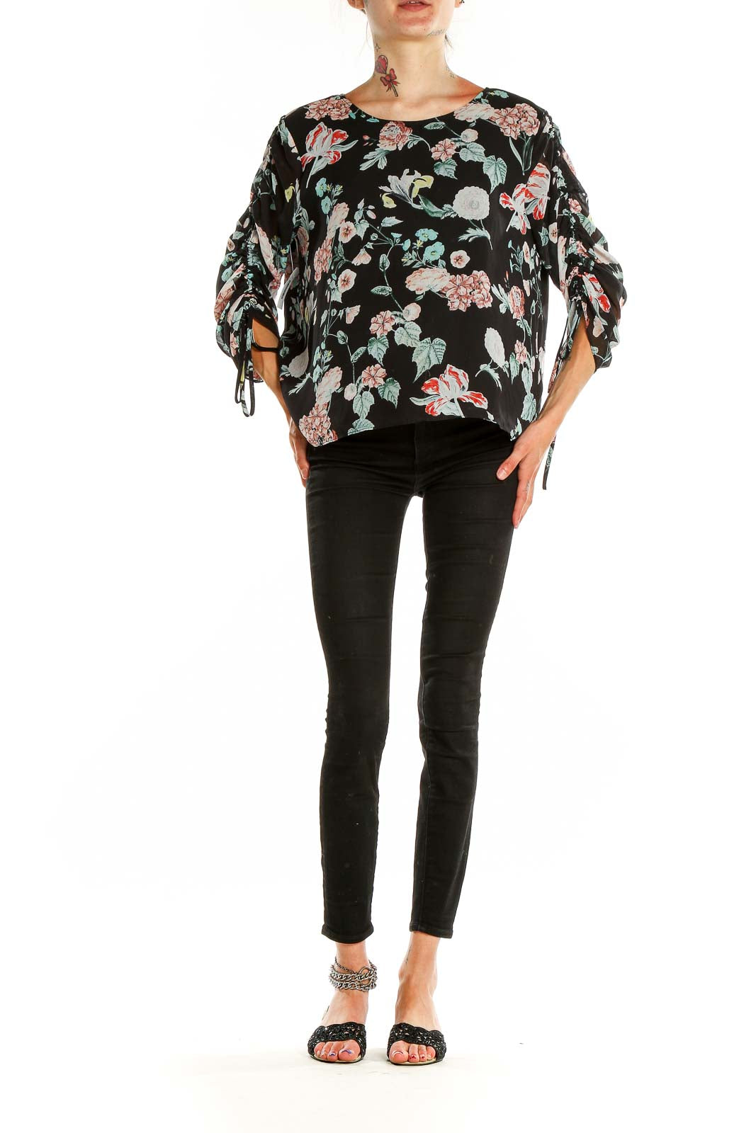 Front view of Vince Camuto black floral print top with ruched sleeves