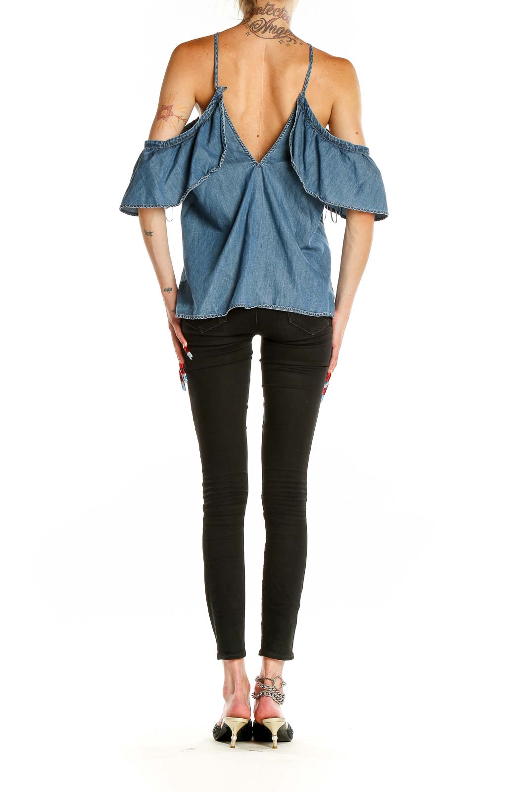 Back view of Express blue denim off-shoulder top showing V-shaped design