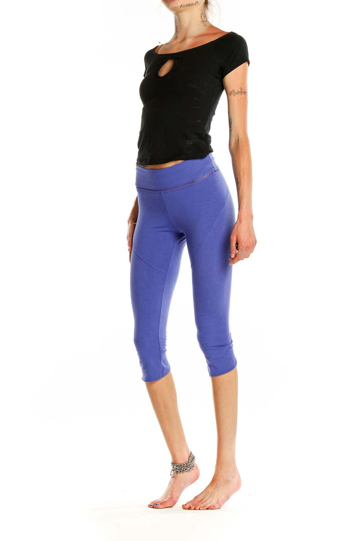 Front view of purple high-waisted capri leggings from Free People Movement