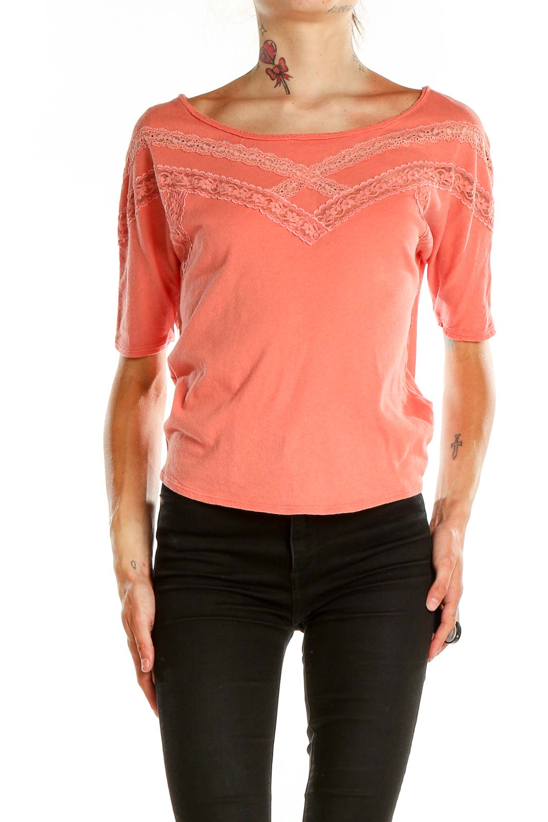 Front view of coral Free People cotton top with lace trim detailing