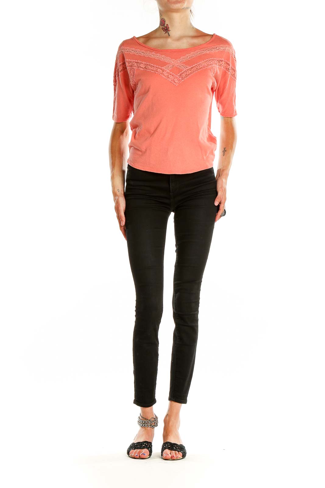 Front view of coral Free People cotton top with lace trim detailing