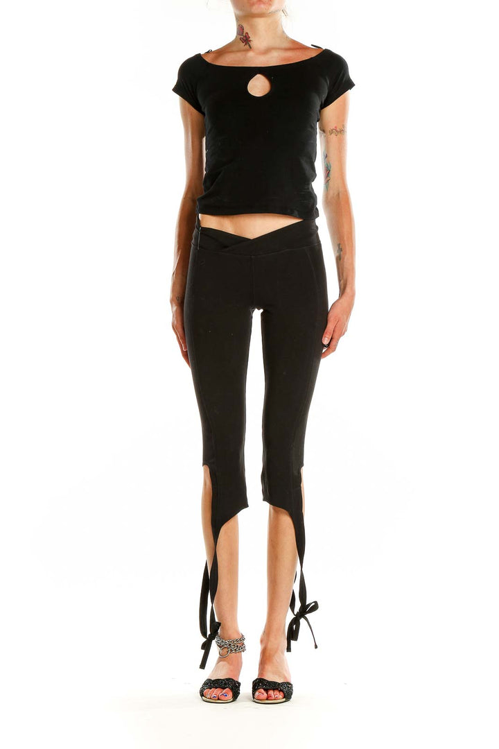 Front view of black tie-ankle activewear leggings from Free People Movement