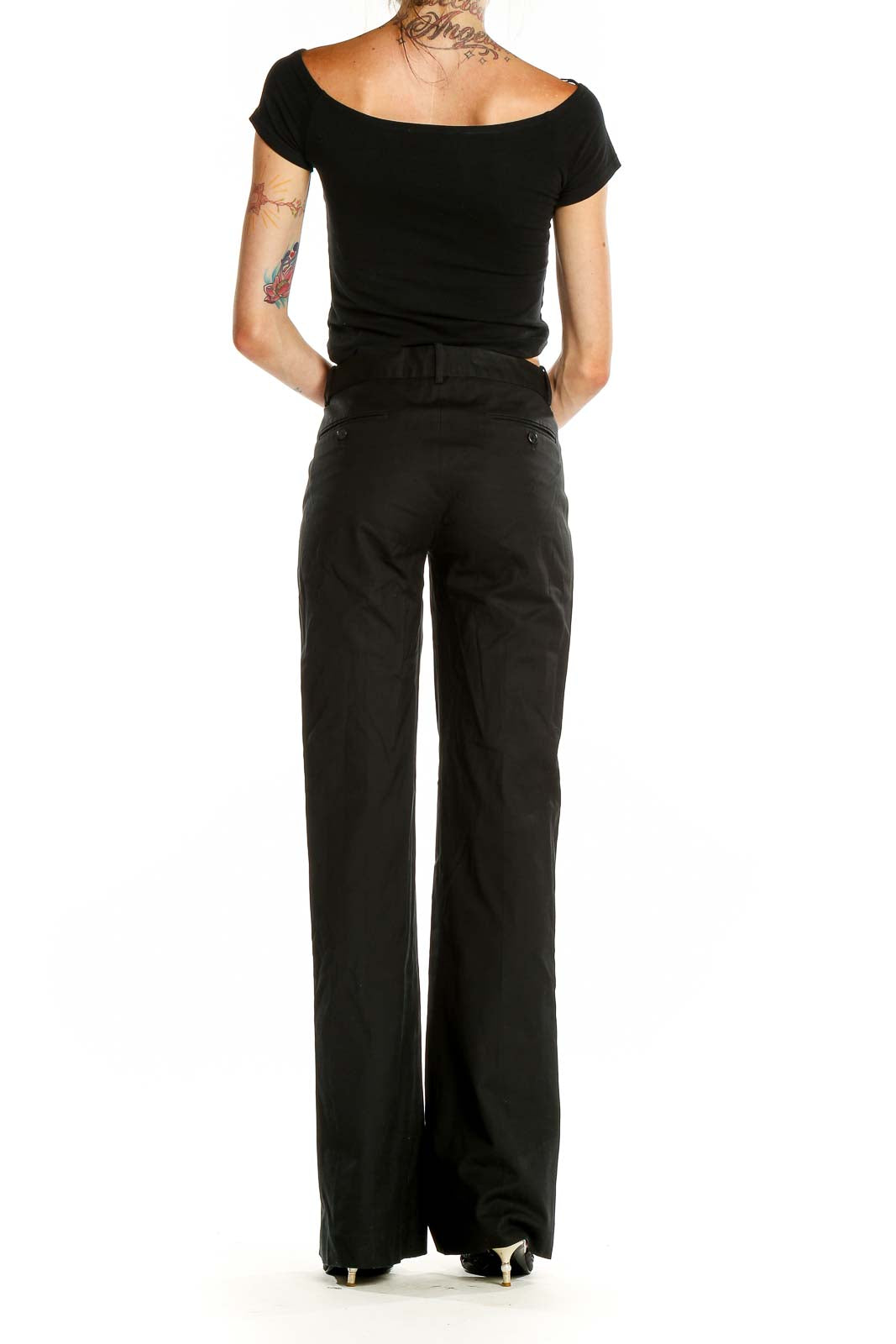 Back view of Theory black wide-leg dress pants on model