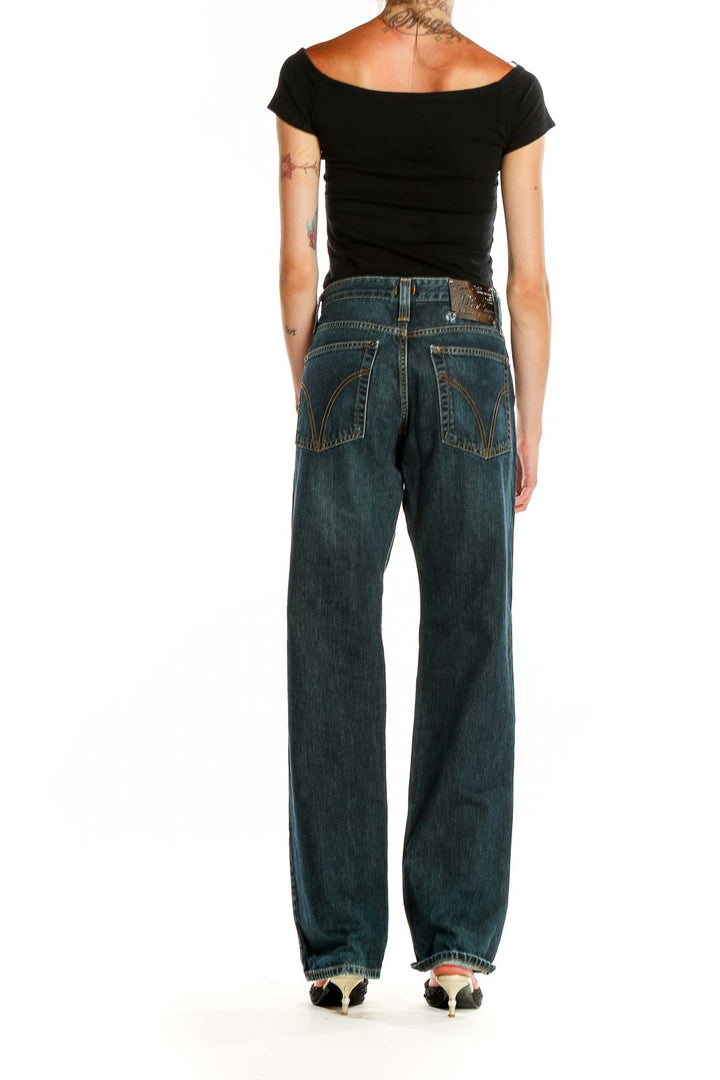 Back view of D&G: Dolce & Gabbana dark blue relaxed fit denim jeans showing signature stitching