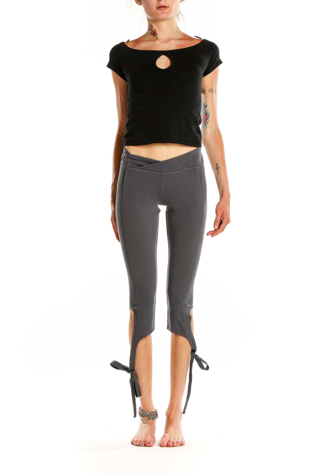 Front view of gray capri leggings with tie-ankle detail and cross-over waistband