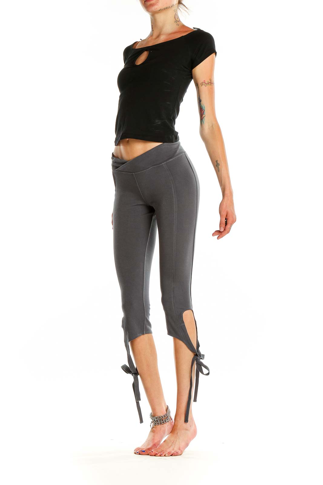 Front view of gray capri leggings with tie-ankle detail and cross-over waistband