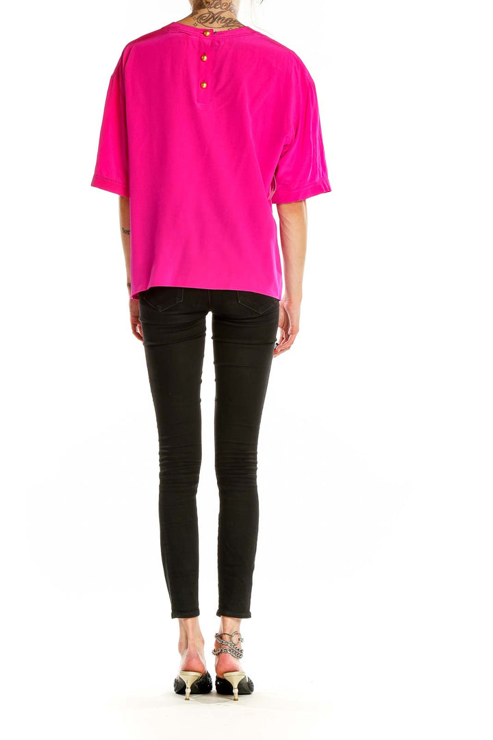 Back view of hot pink Carlisle top showing button detail