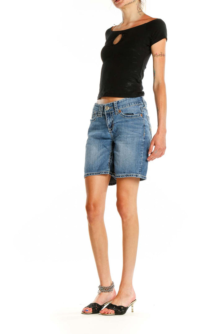 Front view of Seven7 blue denim Bermuda shorts on model