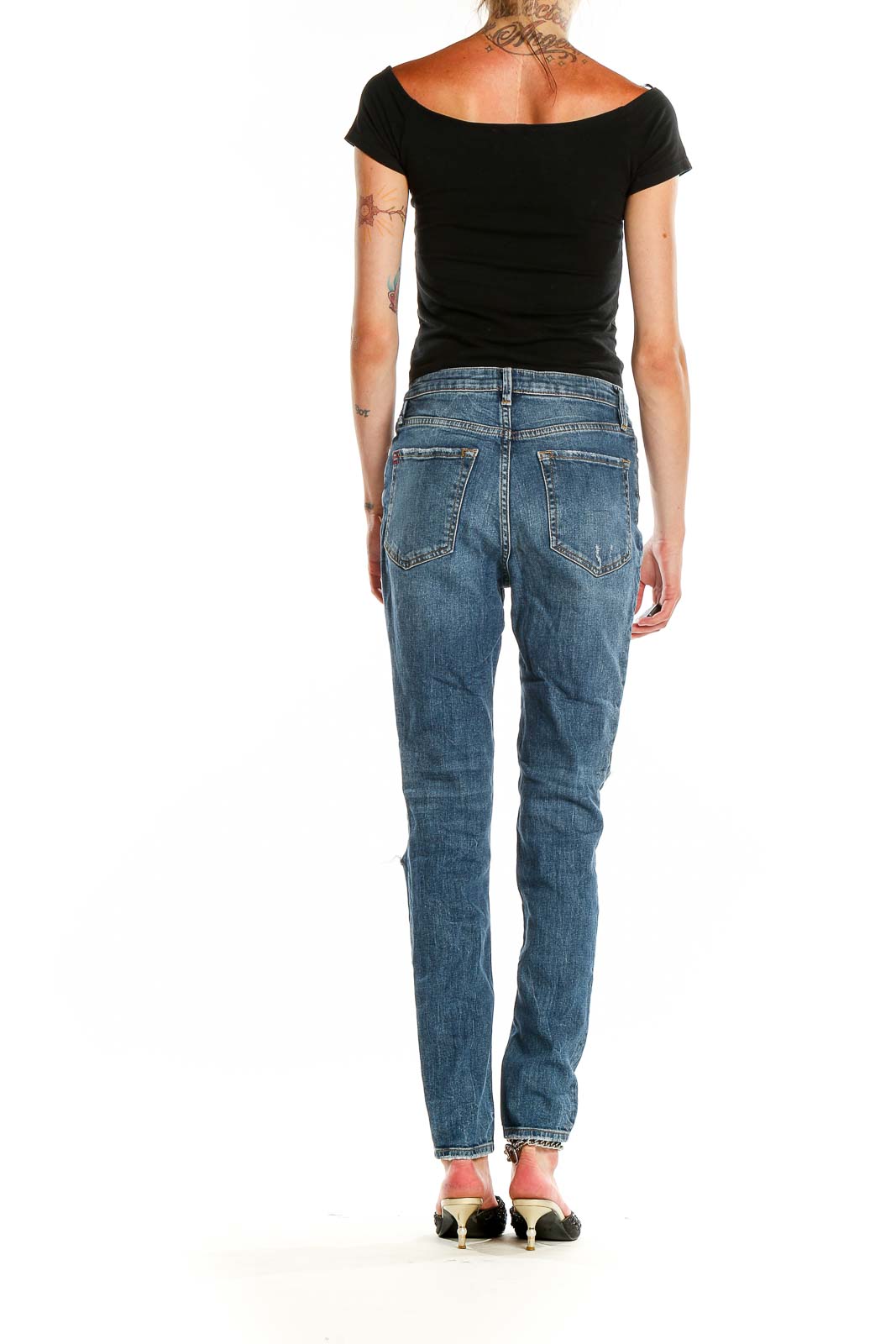 Back view of BDG blue distressed high-rise straight leg jeans on model