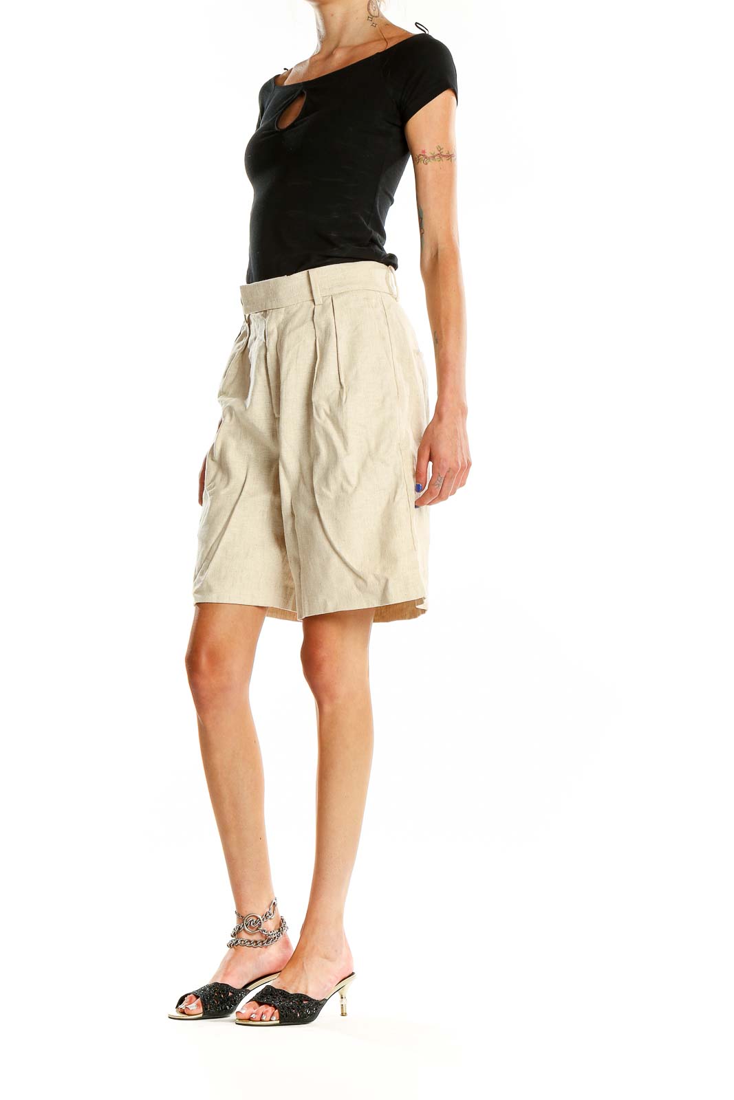 Front view of Banana Republic beige pleated Bermuda shorts on model