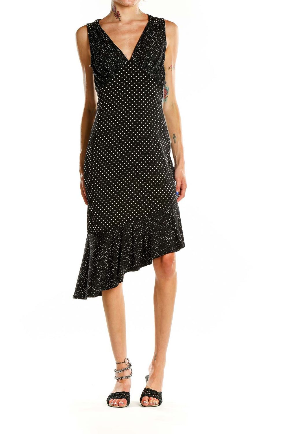 Front view of Leota black polka dot dress with V-neck and asymmetric hem