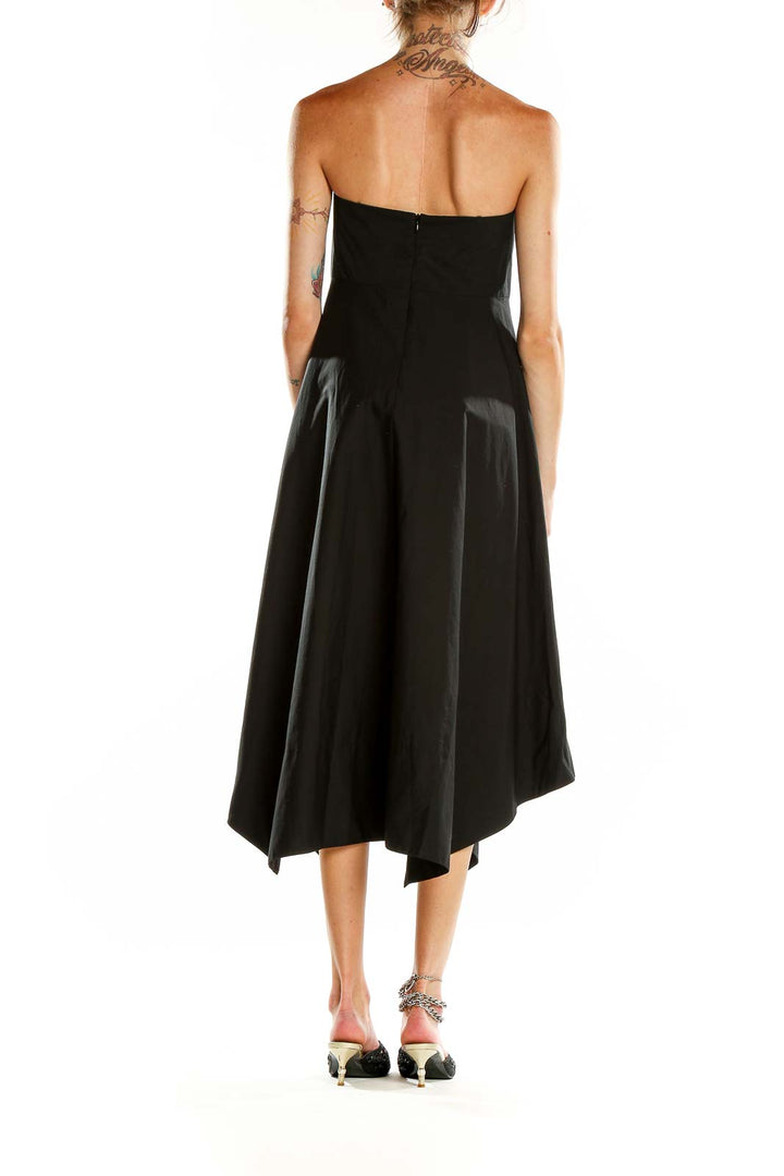 Back view of black strapless asymmetric midi dress from Banana Republic