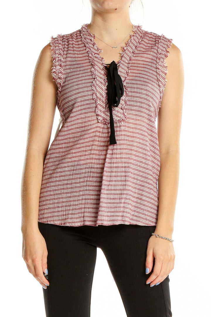 Front view of William Rast pink striped sleeveless cotton top with ruffle neckline