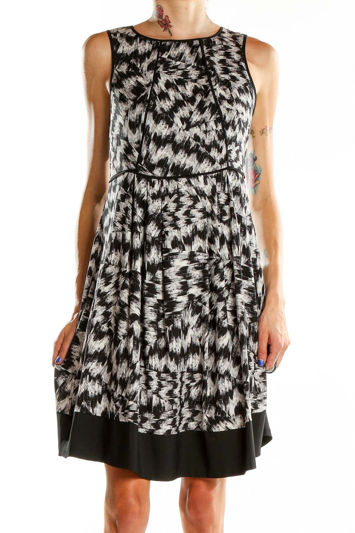 Front view of Vince Camuto black and white abstract print sleeveless dress