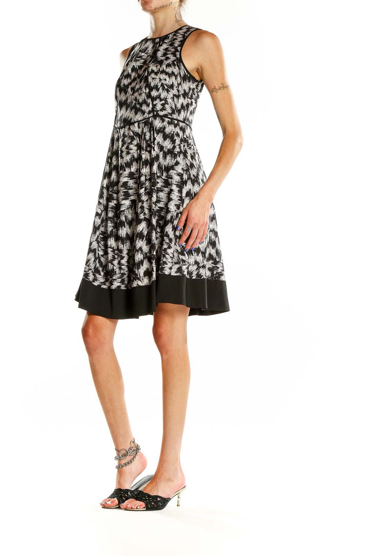 Front view of Vince Camuto black and white abstract print sleeveless dress