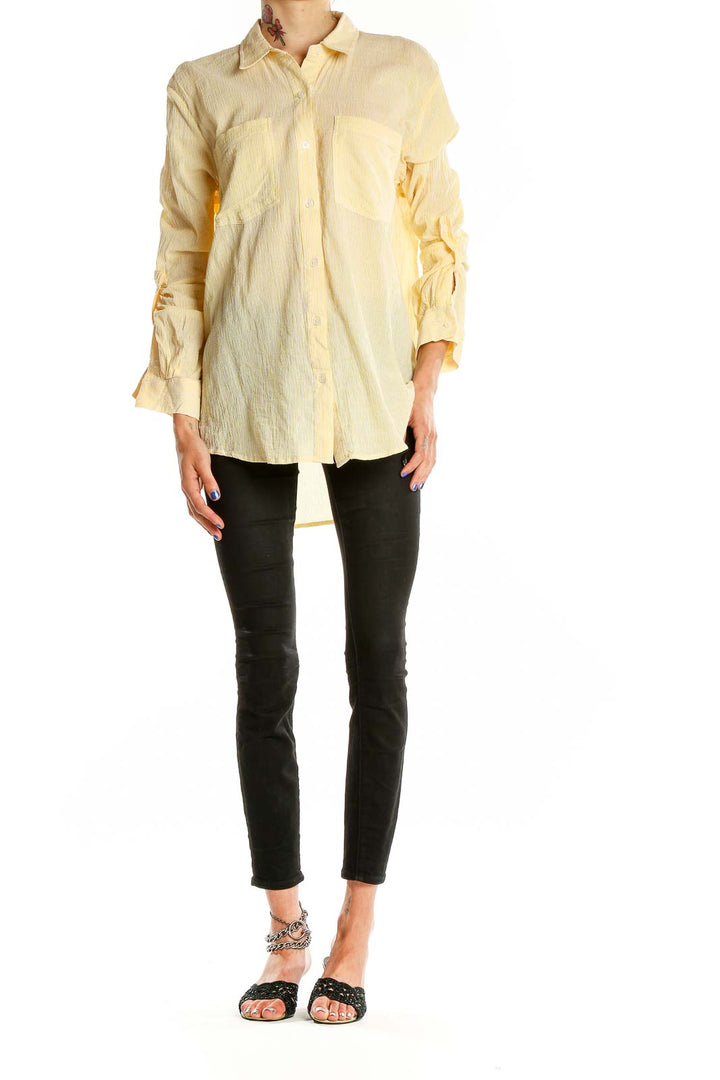 Front view of MICHAEL Michael Kors pale yellow oversized button-down shirt