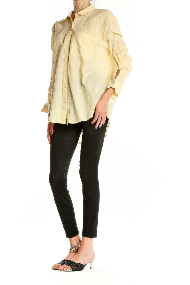 Front view of MICHAEL Michael Kors pale yellow oversized button-down shirt