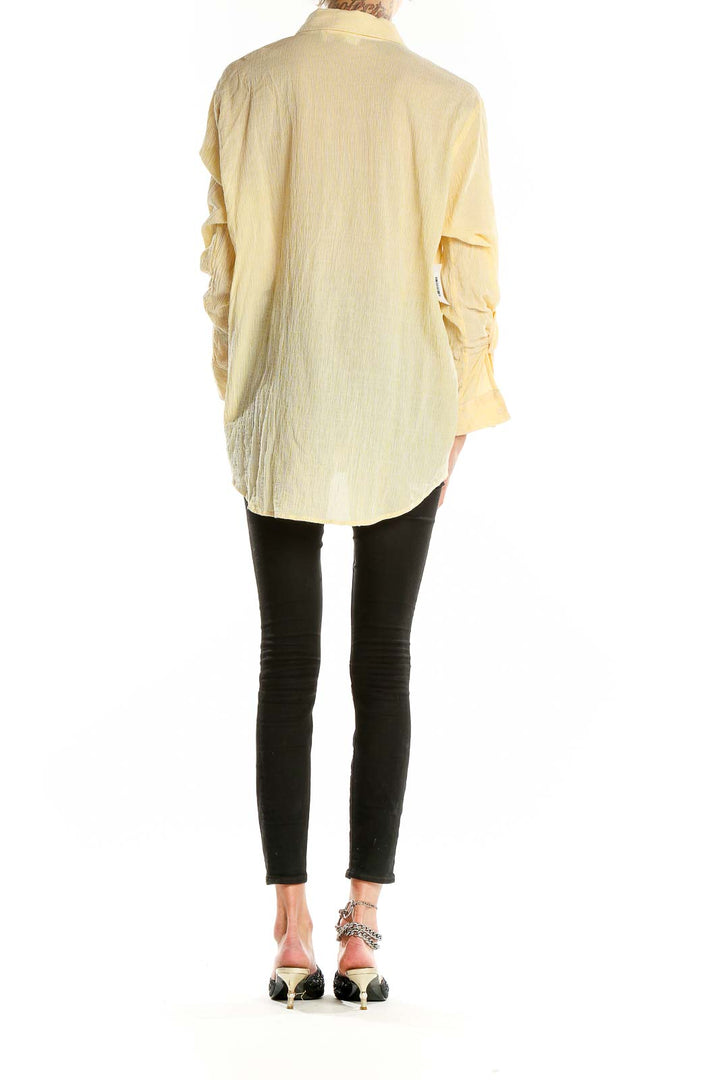 Back view of MICHAEL Michael Kors pale yellow oversized button-down shirt