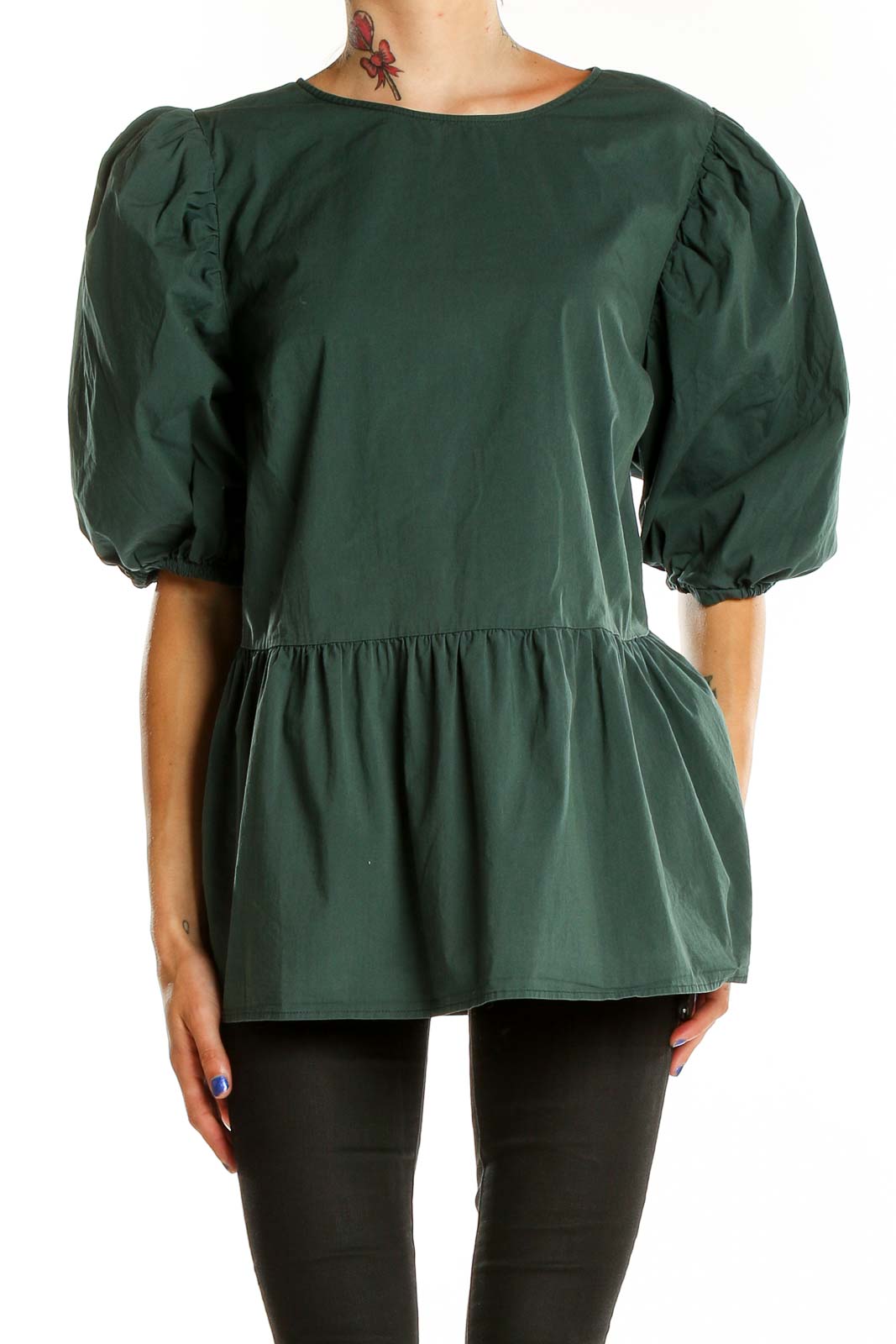 Front view of Eloquii forest green puff sleeve peplum top on model