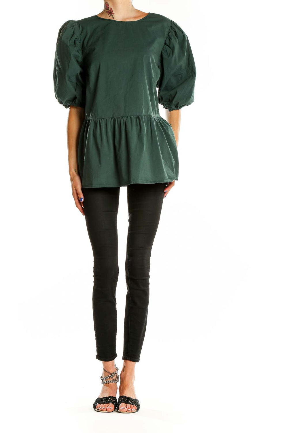 Front view of Eloquii forest green puff sleeve peplum top on model