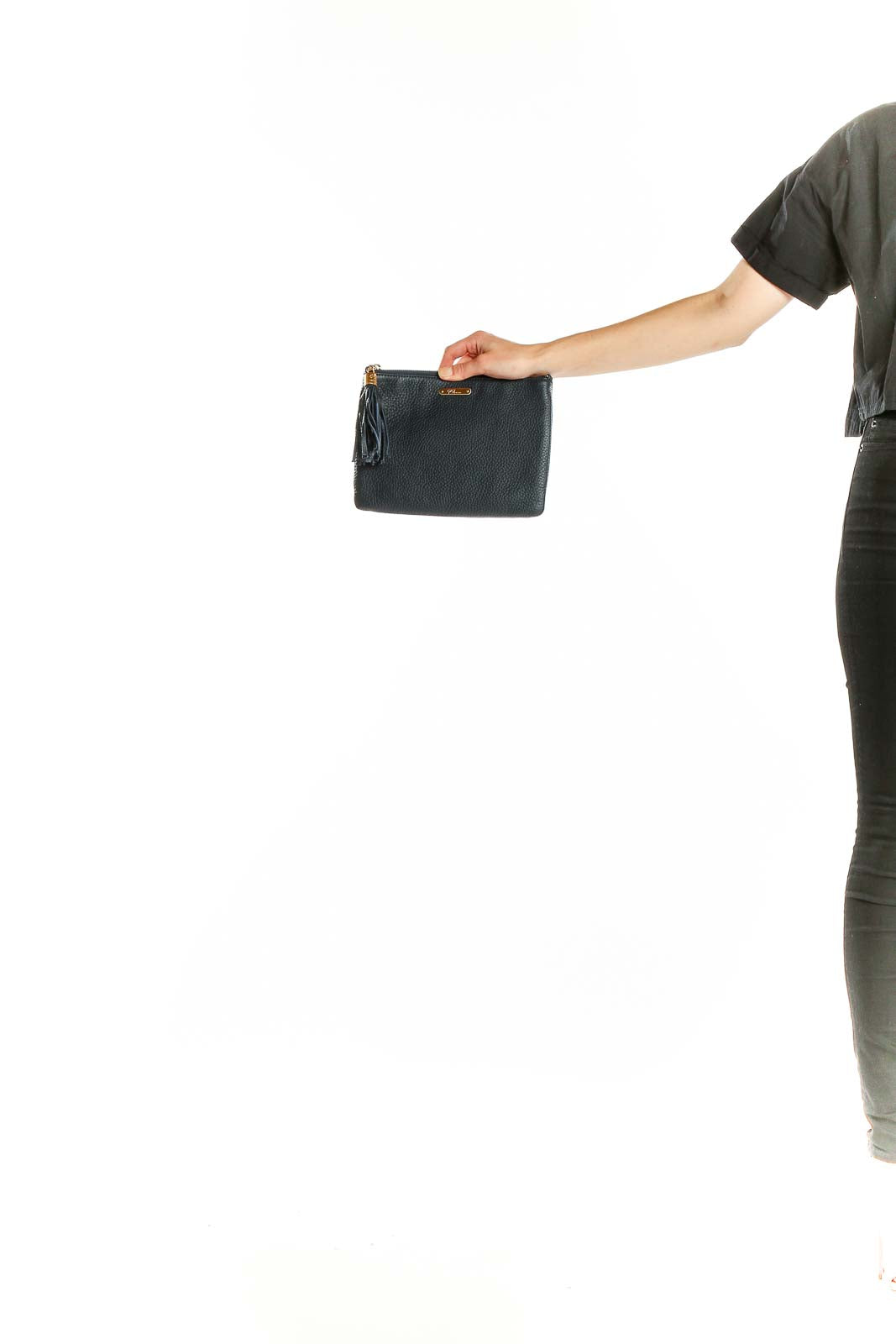 Front view of GiGi New York black leather clutch with tassel