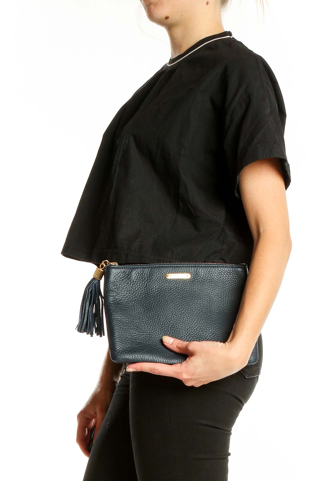 Front view of GiGi New York black leather clutch with tassel