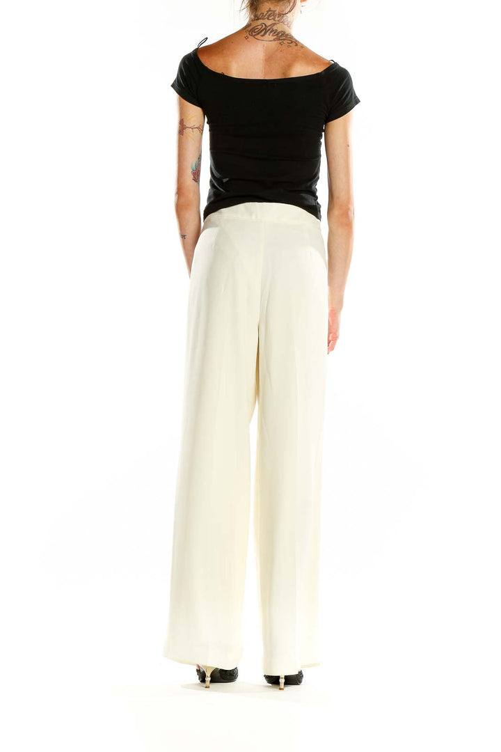 Back view of Vince Camuto ivory wide-leg dress pants on model