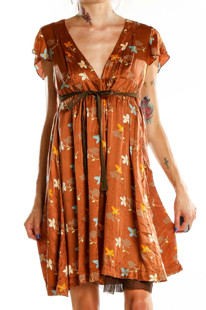 Front view of Free People rust floral empire waist mini dress with V-neckline