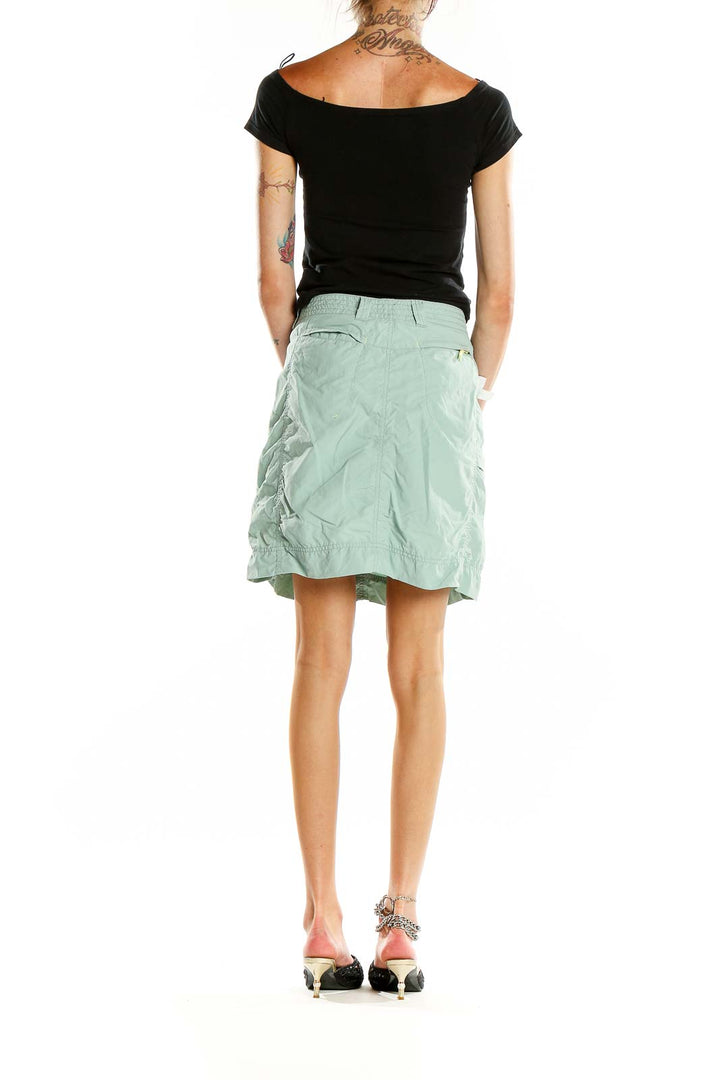 Back view of mint green Eddie Bauer athletic skirt on model